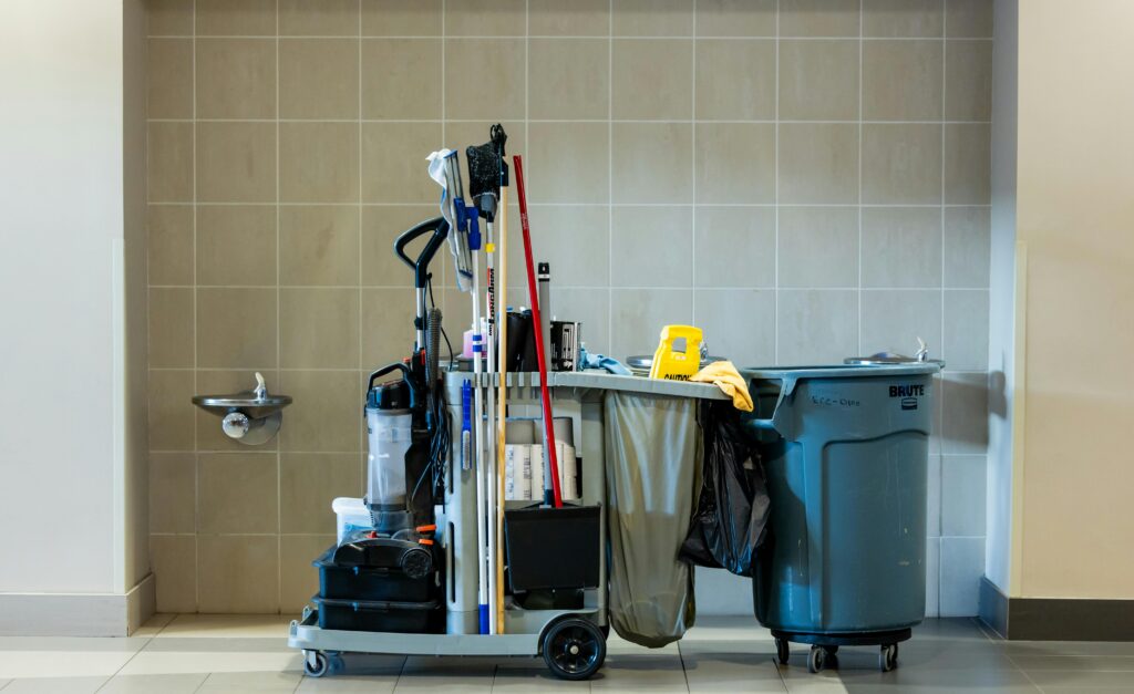 pexels-photo-34516664-34516664 A comprehensive collection of professional cleaning tools on a cart in an indoor environment.